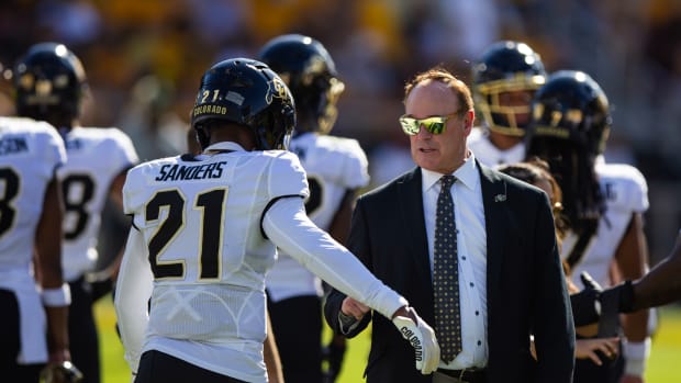 Colorado Buffaloes athletic director Rick George with safety Shilo Sanders (21) against the Arizona State Sun Devils at Mountain America Stadium